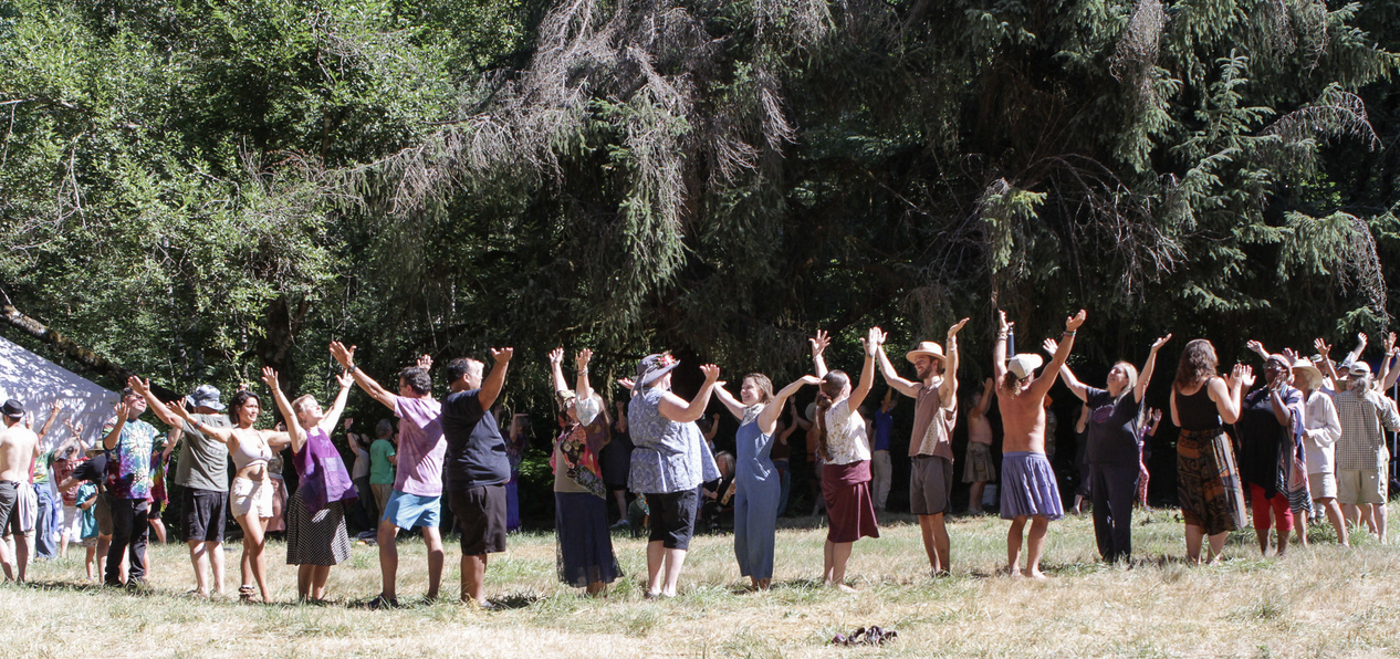 people standing in a circle greeting each other